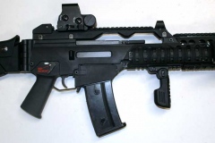 Non-firing replica custom G-36 assault rifle with silencer.
