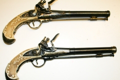 Replica Flintlock Dueling Pistols with ivory grips.