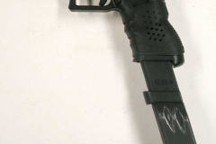 Non-firing replica Glock with extended magazine