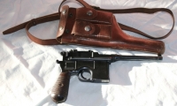 moviegunguy.com, movie prop handguns, semi-automatic, broomhandle mauser and holster
