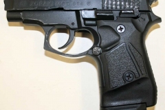 Blank-firing .380 compact automatic pistol.