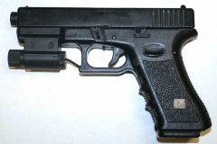 Non-firing replica Glock 17 pistol with laser sight.