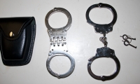 moviegunguy.com,  Instruments of Torture, police handcuffs and case