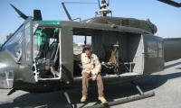 Mike Tristano sitting on a helicopter