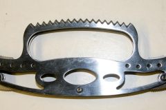 Double-bladed folding knife with serrated hand guard