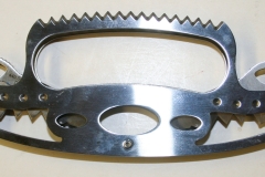 Double-bladed knife with serrated hand guard